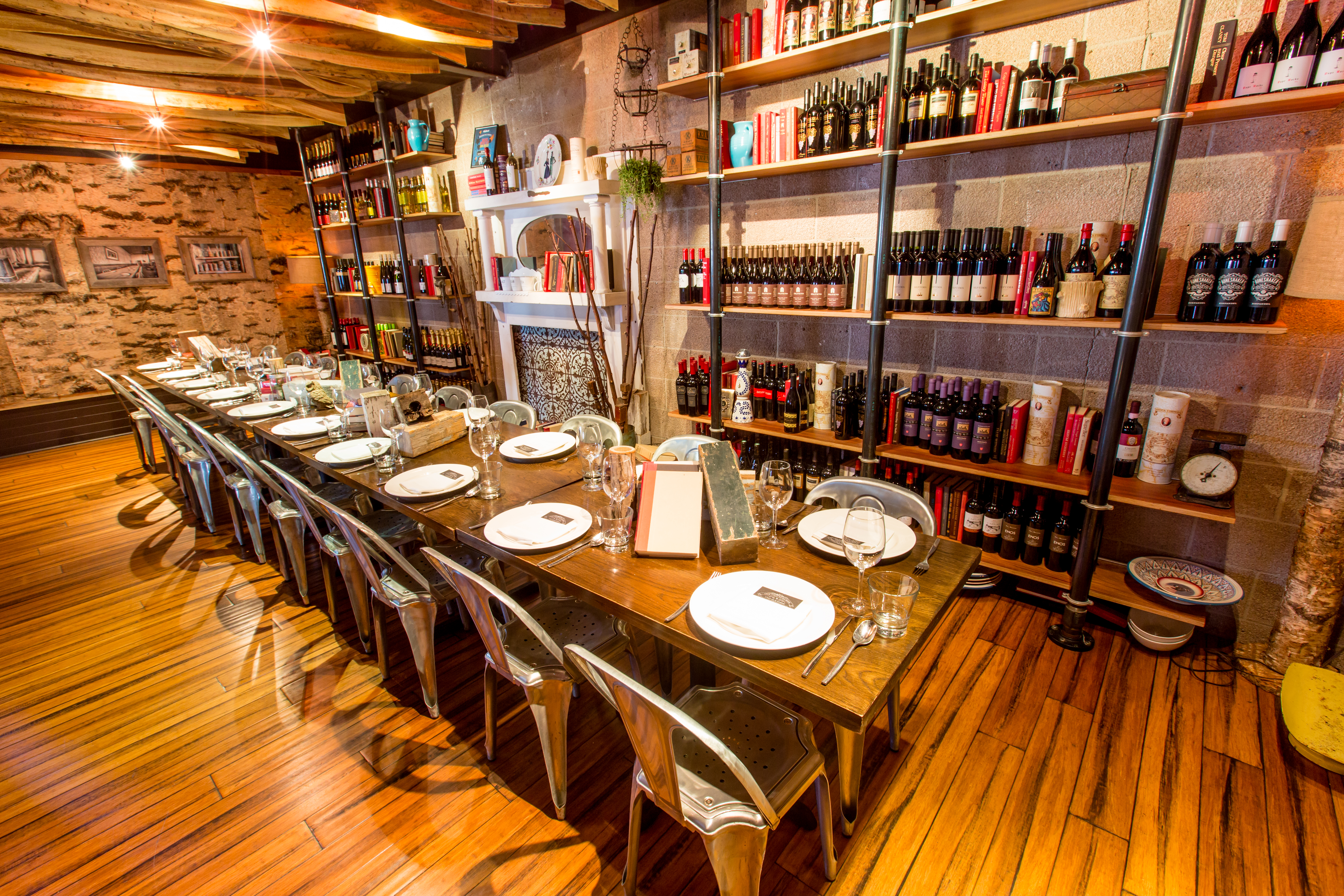 We will set up one long table for your party of up to 26 guests where we will serve family style food that makes everyone feel like they are at a dinner party in your home library.